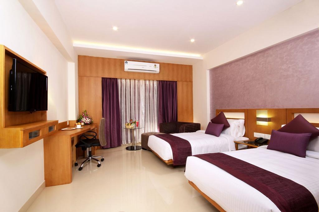 Hotel Chrysoberyl Kottayam Rum bild