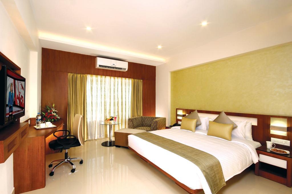 Hotel Chrysoberyl Kottayam Rum bild